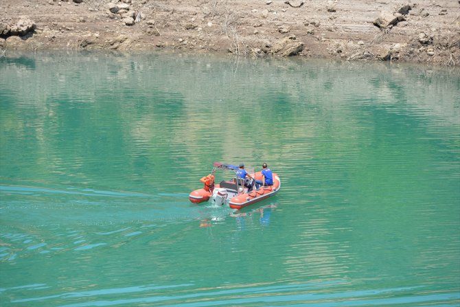 Kayıp Doku'nun bulunması için Uzunçayır Baraj Gölü'nün kısmen boşaltılması çalışmaları sürüyor