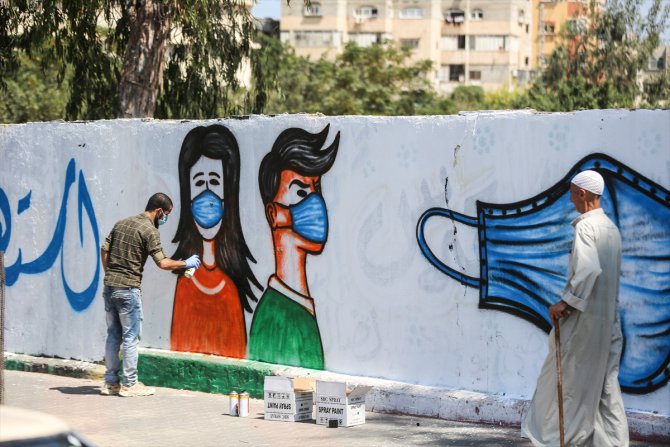 Gazze'de halk, duvar resimleriyle Kovid-19'a karşı bilinçlendiriliyor