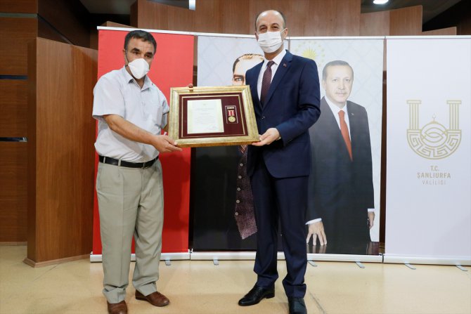 Şehit yakınları ve gazilere Devlet Övünç Madalyası ve Beratı Tevcih Töreni